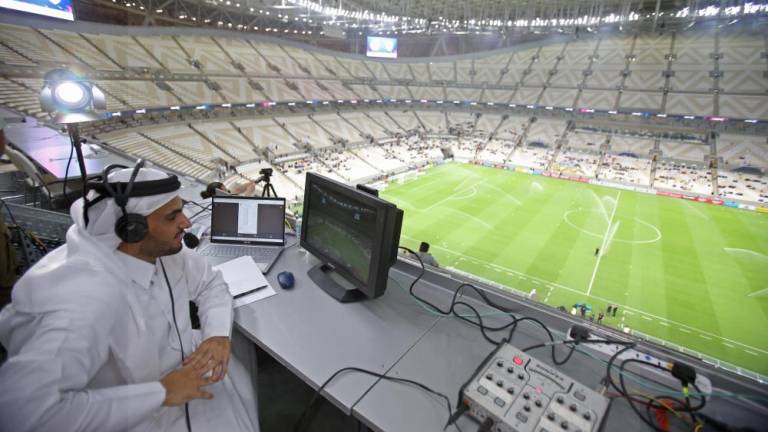 a-commentator-prepares-for-the-qatar_21-3059471_20220909210335